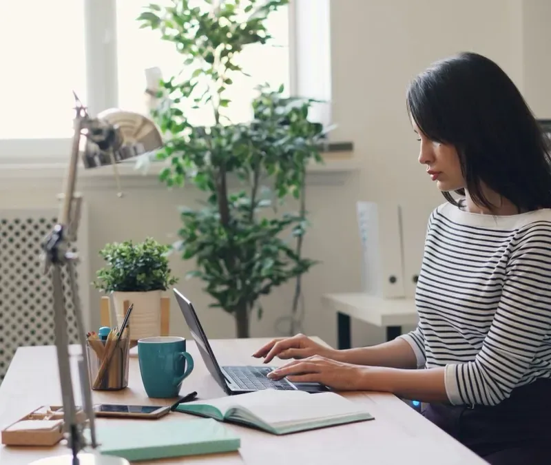 Someone working through material at a laptop