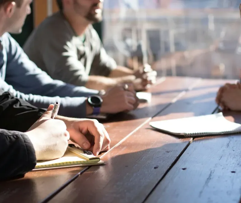 Colleagues reading through documents together at a table